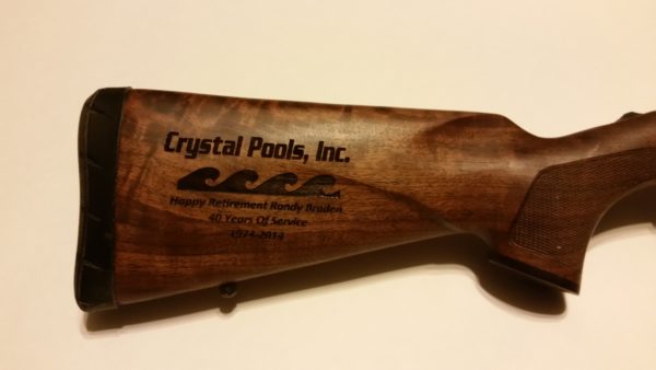 Custom engraved gun stock.