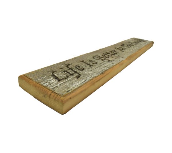 Barnwood door topper sign that reads, "Life Is Better At The Cottage".