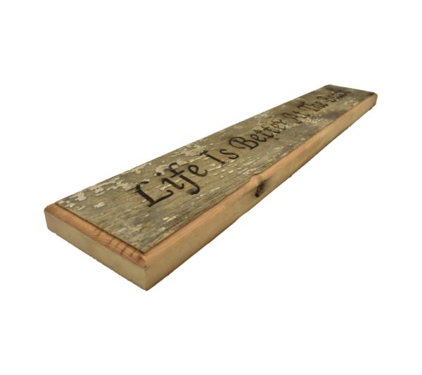 Barnwood door topper sign that reads, "Life Is Better At The Beach".