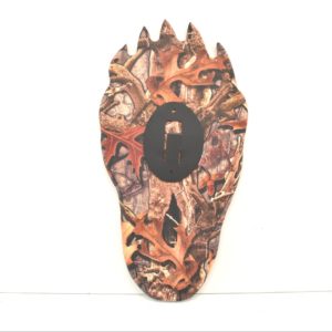 Bear paw plaque with camouflage design printed on it.
