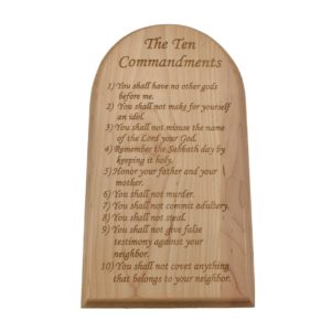 Engraved hardwood sign with an arched top and inscribed with the Ten Commandments.