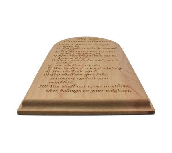 Engraved hardwood sign with an arched top and inscribed with the Ten Commandments.