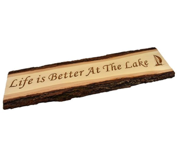 Engraved live edge door topper sign that reads, "Life is Better at the Lake".