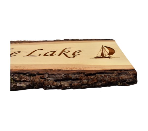 Engraved live edge door topper sign that reads, "Life is Better at the Lake".