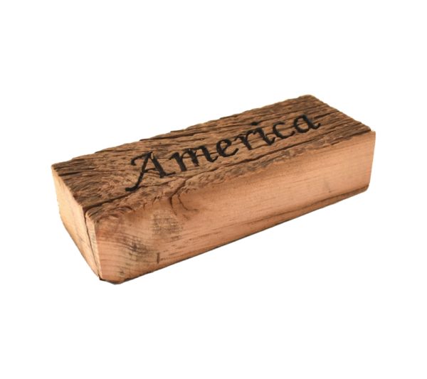 Reclaimed barn wood block sign that reads, "America".