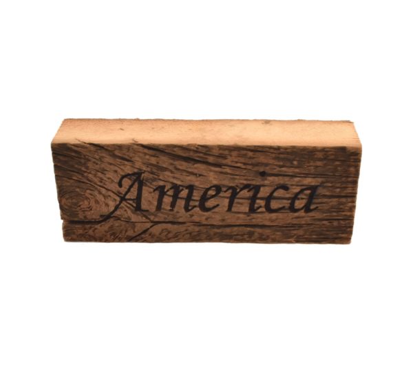 Reclaimed barn wood block sign that reads, "America".