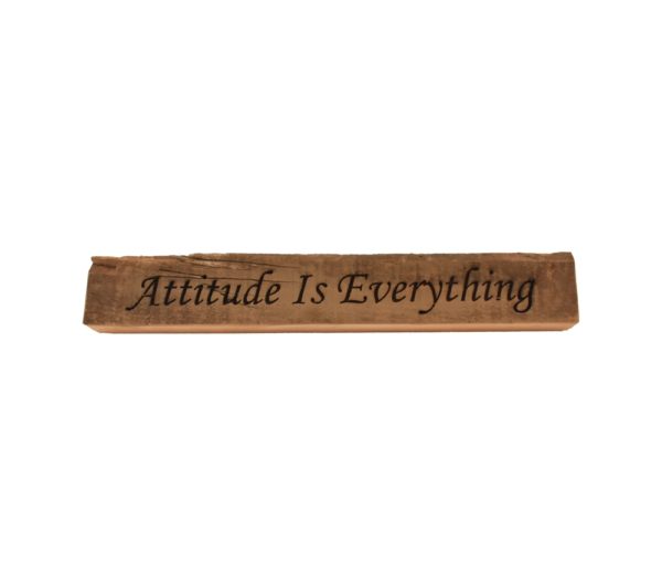 Reclaimed barn wood block sign that reads, "Attitude Is Everything".