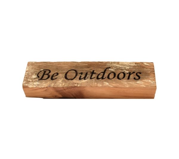 Reclaimed barn wood block sign that reads, "Be Outdoors".