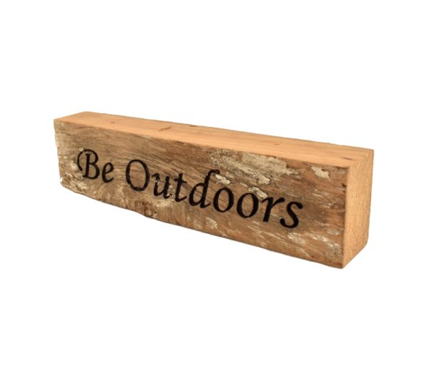 Reclaimed barn wood block sign that reads, "Be Outdoors".