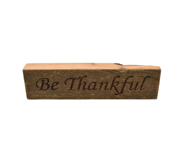 Reclaimed barn wood block sign that reads, "Be Thankful".