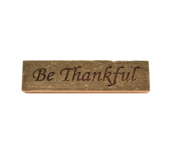 Reclaimed barn wood block sign that reads, "Be Thankful".