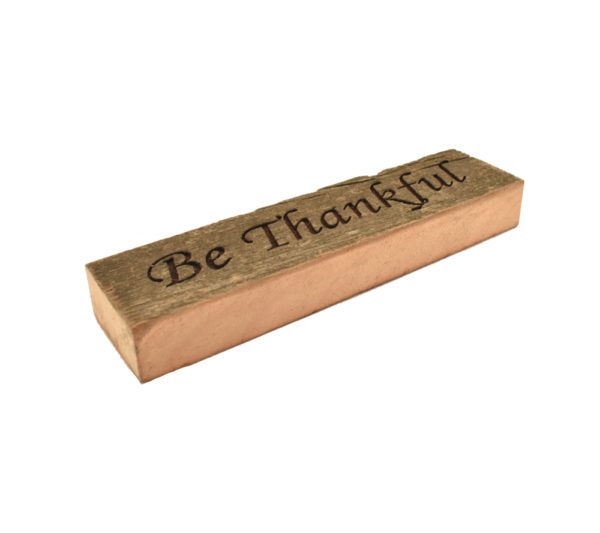 Reclaimed barn wood block sign that reads, "Be Thankful".