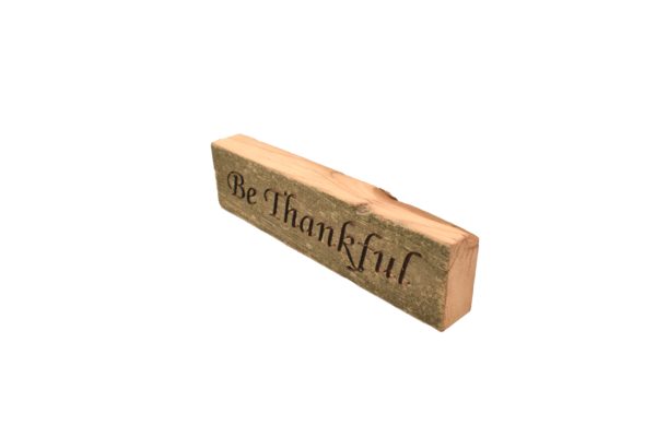 Reclaimed barn wood block sign that reads, "Be Thankful".