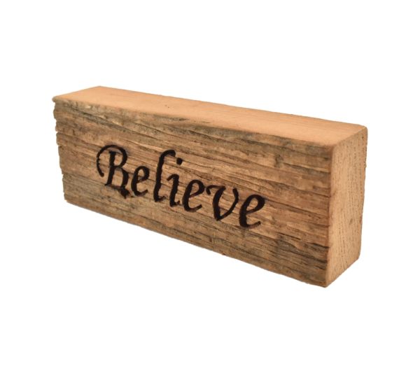 Reclaimed barn wood block sign that reads, "Believe".