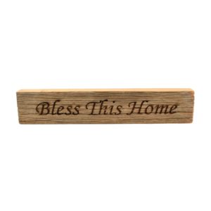 Reclaimed barn wood block sign that reads, "Bless This Home".