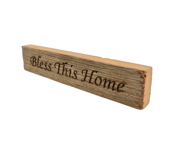 Reclaimed barn wood block sign that reads, "Bless This Home".