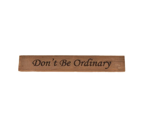 Reclaimed barn wood block sign that reads, "Don't Be Ordinary".