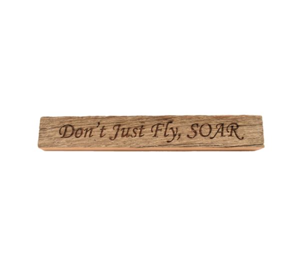 Reclaimed barn wood block sign that reads, "Don't Just Fly, SOAR".