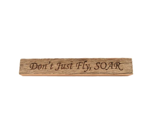 Reclaimed barn wood block sign that reads, "Don't Just Fly, SOAR".