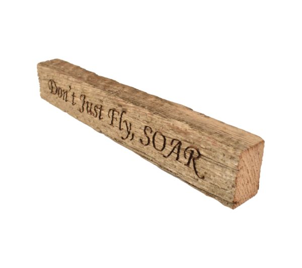 Reclaimed barn wood block sign that reads, "Don't Just Fly, SOAR".