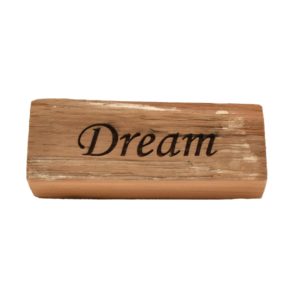 Reclaimed barn wood block sign that reads, "Dream".