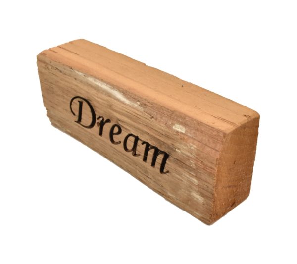 Reclaimed barn wood block sign that reads, "Dream".