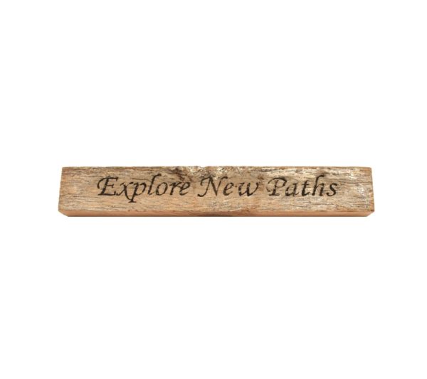 Reclaimed barn wood block sign that reads, "Explore New Paths".