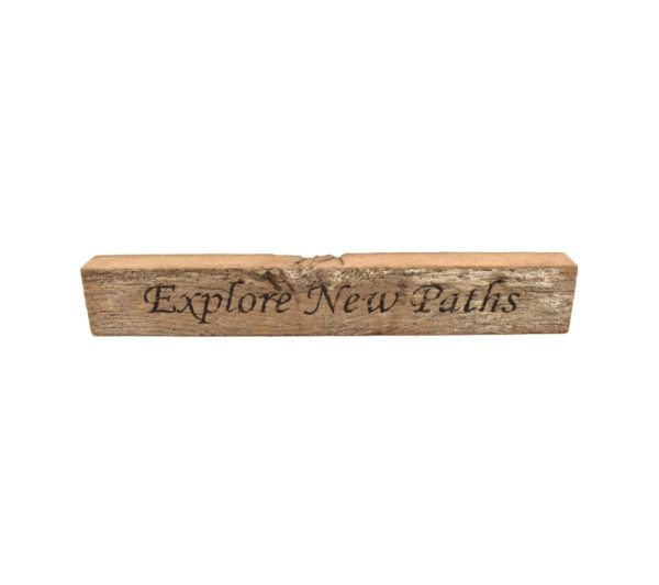 Reclaimed barn wood block sign that reads, "Explore New Paths".