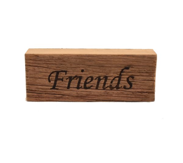 Reclaimed barnwood sign that reads, "Friends".