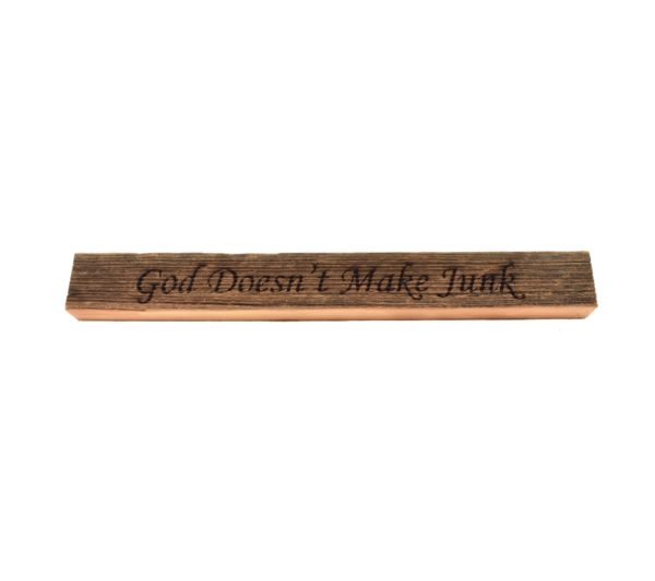 Reclaimed barn wood block sign that reads, "God Doesn't Make Junk".