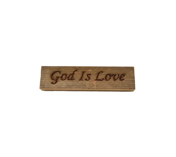 Reclaimed barnwood sign that reads, "God Is Love".