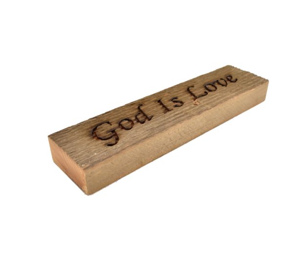 Reclaimed barnwood sign that reads, "God Is Love".