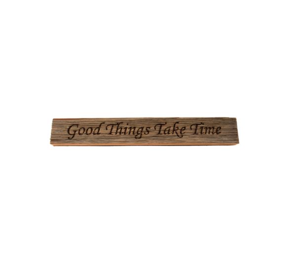 Reclaimed barn wood block sign that reads, "Good Things Take Time".