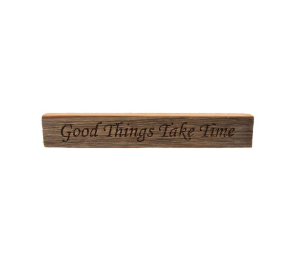 Reclaimed barn wood block sign that reads, "Good Things Take Time".