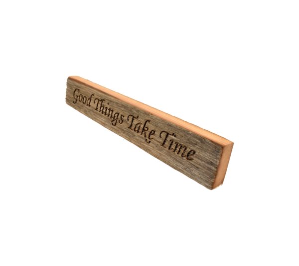 Reclaimed barn wood block sign that reads, "Good Things Take Time".