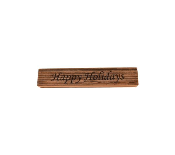 Reclaimed barn wood block sign that reads, "Happy Holidays".