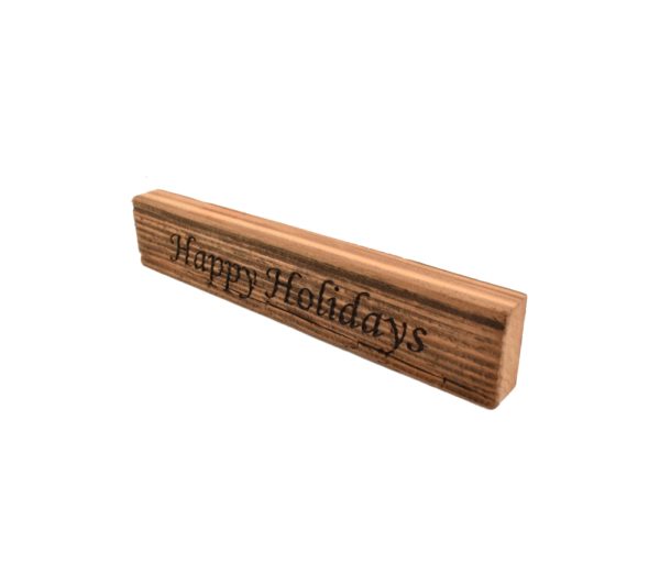 Reclaimed barn wood block sign that reads, "Happy Holidays".