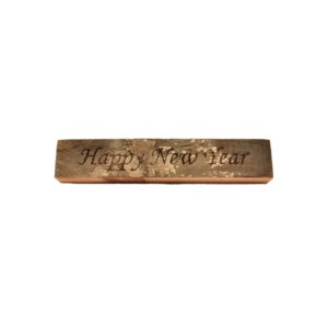Reclaimed barnwood sign that reads, "Happy New Year".