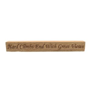 Reclaimed barn wood block sign that reads, "Hard Climbs End With Great Views".