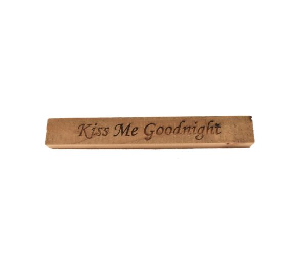 Reclaimed barn wood block sign that reads, "Kiss Me Goodnight".