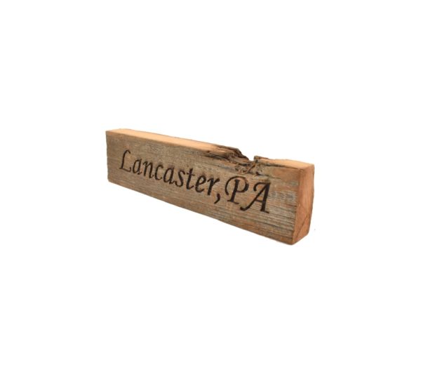 Reclaimed barn wood block sign that reads, "Lancaster, PA".