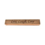 Reclaimed barn wood block sign that reads, "Live, Laugh, Love".