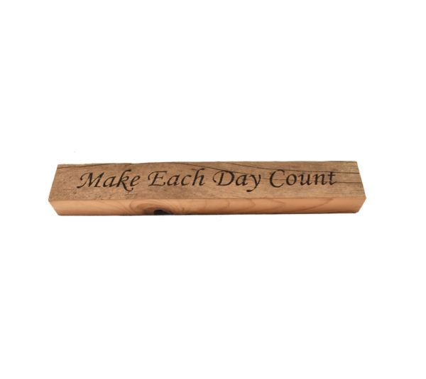 Reclaimed barn wood block sign that reads, "Make Each Day Count".