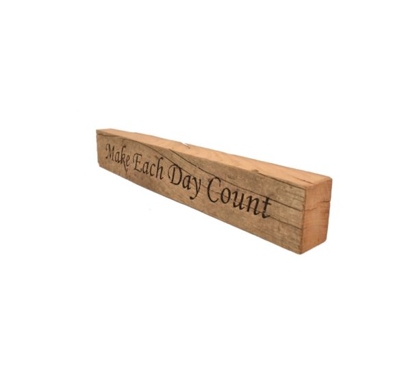 Reclaimed barn wood block sign that reads, "Make Each Day Count".