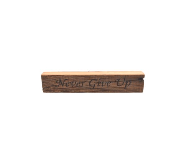 Reclaimed barn wood block sign that reads, "Never Give Up".