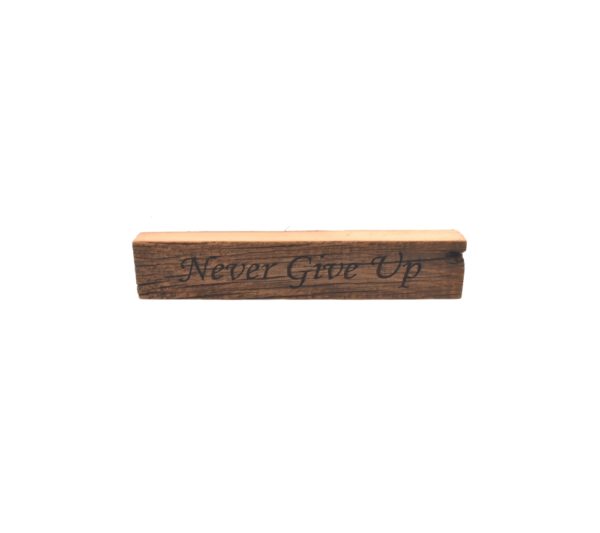 Reclaimed barn wood block sign that reads, "Never Give Up".