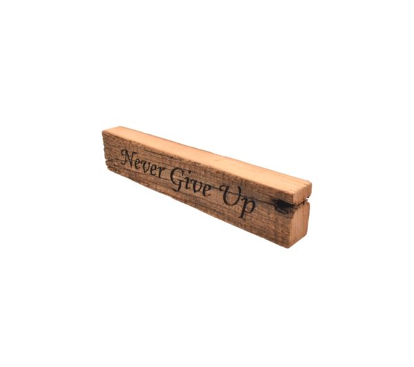 Reclaimed barn wood block sign that reads, "Never Give Up".
