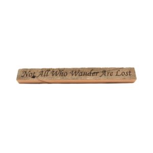 Reclaimed barn wood block sign that reads, "Not All Who Wander Are Lost".