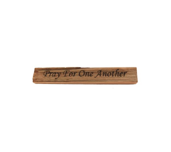 Reclaimed barn wood block sign that reads, "Pray For One Another".