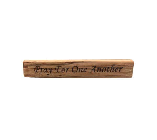 Reclaimed barn wood block sign that reads, "Pray For One Another".